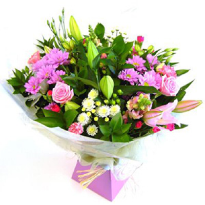 Stunning Handtie - A luxurious display of the freshest and prettiest flowers delivered to the address of your choice. Aqua packed with water  for convenience. Colours and flowers may vary.